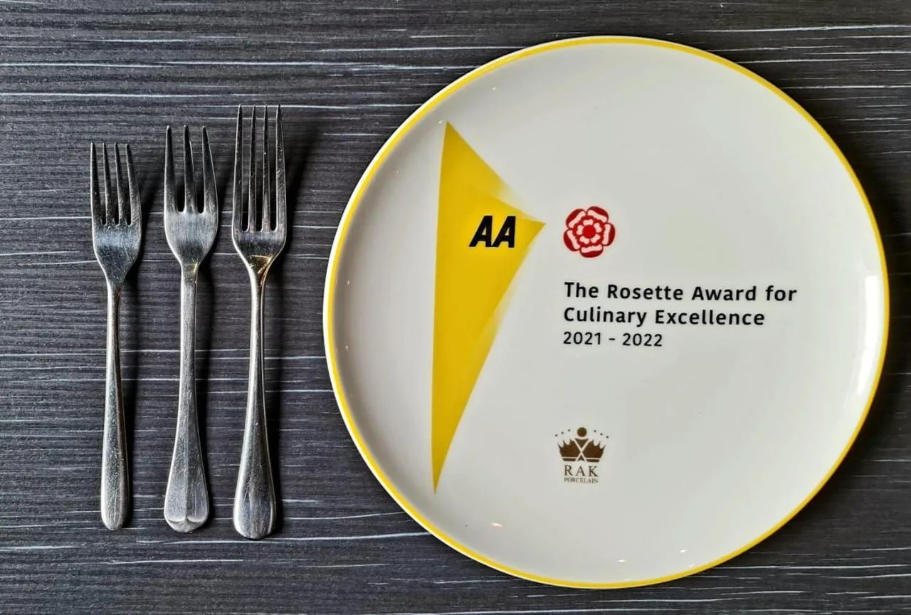 a plate with cutlery on a table at No11 Boutique Hotel & Brasserie in Edinburgh